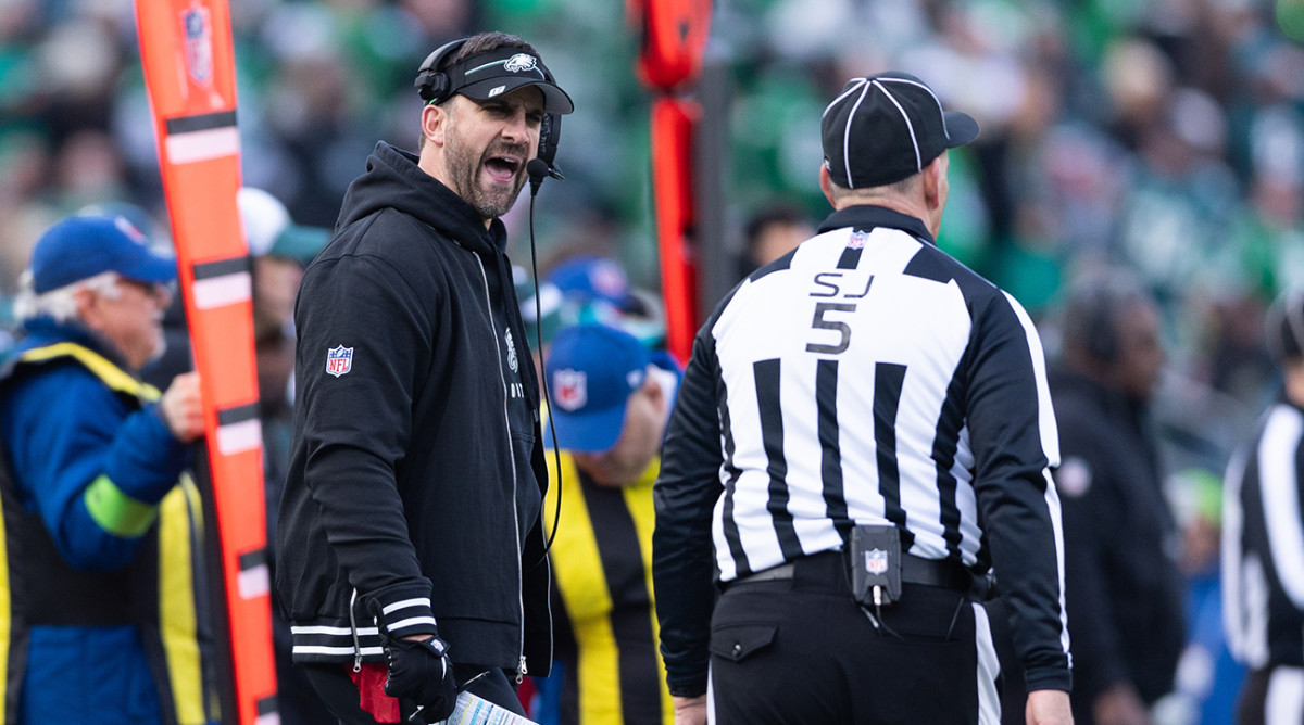 Eagles Nick Sirianni reacts with side judge Jim Quirk (5) after a play during the third quarter against the Cardinals at Lincoln Financial Field.